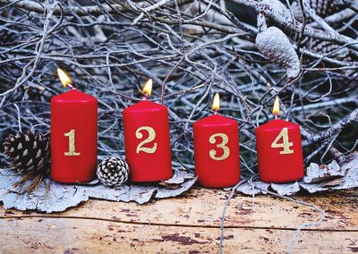 Four red advent candles with number as Catholic symbol of Christmas